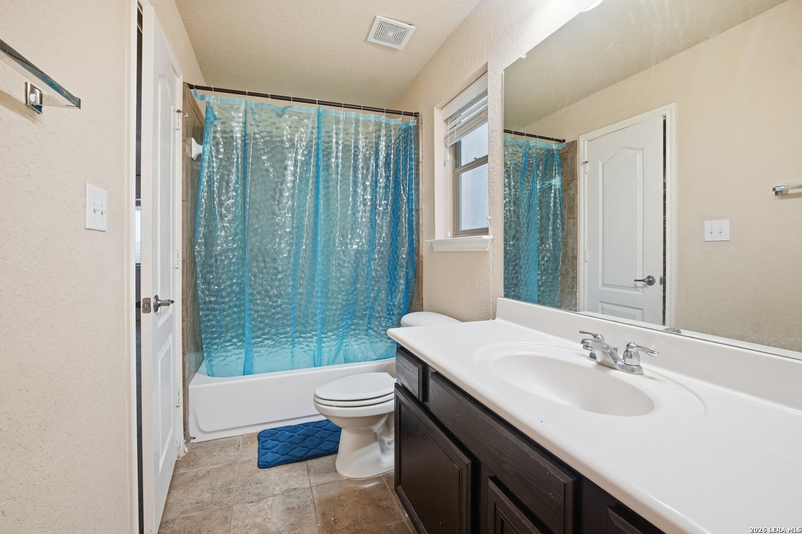 313 Brook Shadow Cibolo, TX 78108 - Photo 21 of 29 a bathroom with a sink toilet a mirror and shower