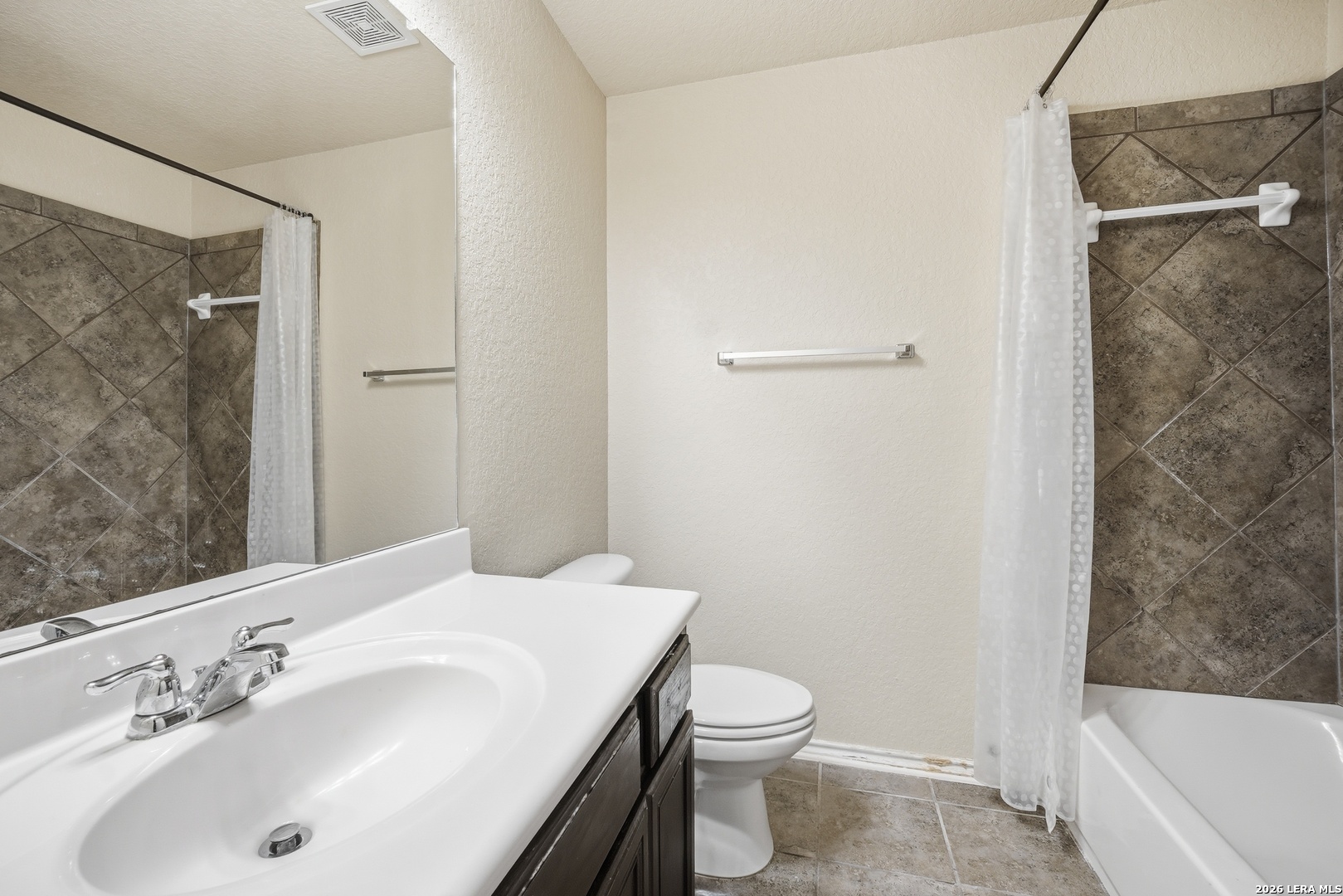 313 Brook Shadow Cibolo, TX 78108 - Photo 25 of 29 a bathroom with a sink and a mirror