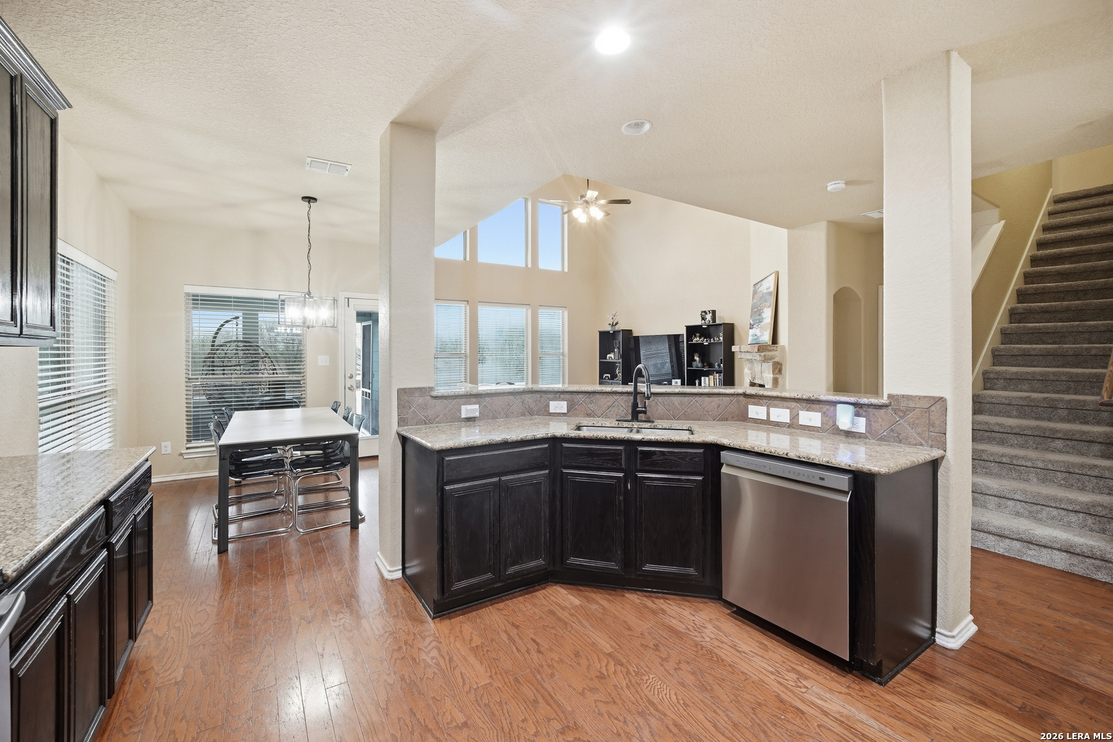 313 Brook Shadow Cibolo, TX 78108 - Photo 7 of 29 a kitchen with stainless steel appliances granite countertop a stove and a wooden floors