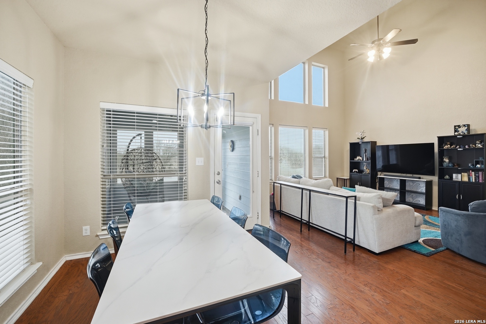 313 Brook Shadow Cibolo, TX 78108 - Photo 9 of 29 a living room with furniture a flat screen tv and wooden floor
