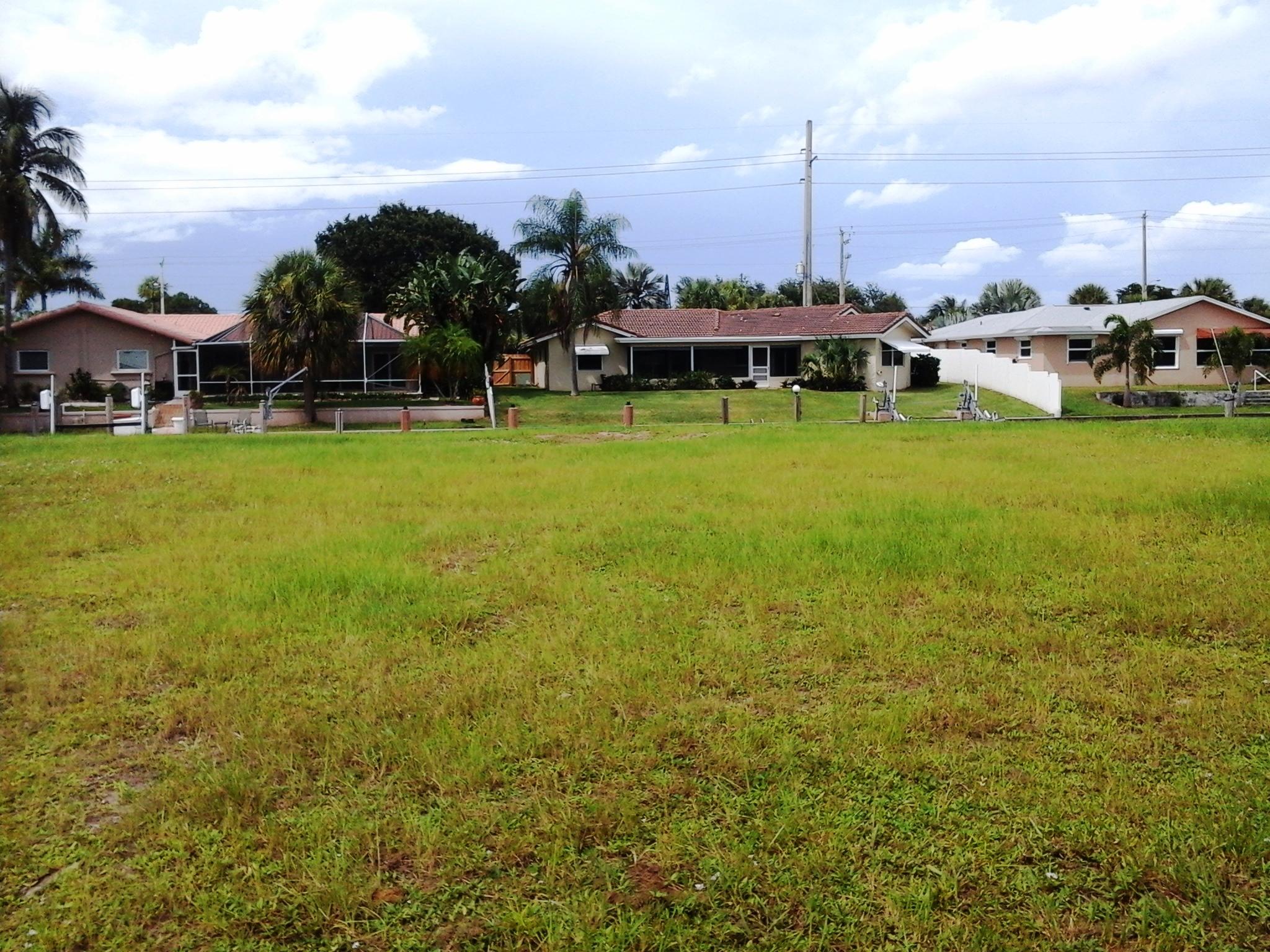 621 West Royal Palm Road Boca Raton, FL 33486 - Photo 2 of 6 a view of a big yard with table and chairs