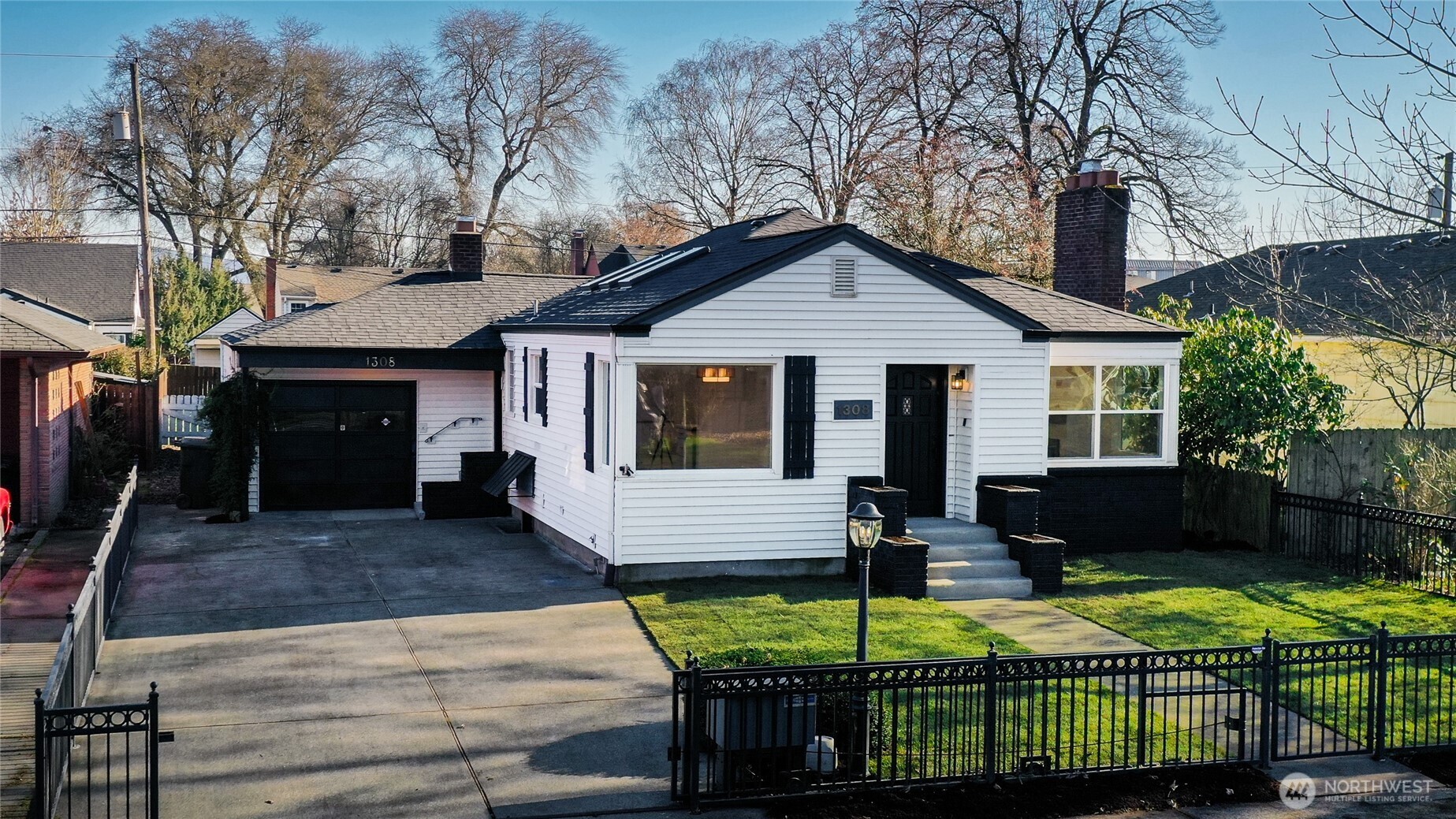 1308 19th Avenue Longview, WA 98632 - Photo 1 of 24 a front view of a house with garden
