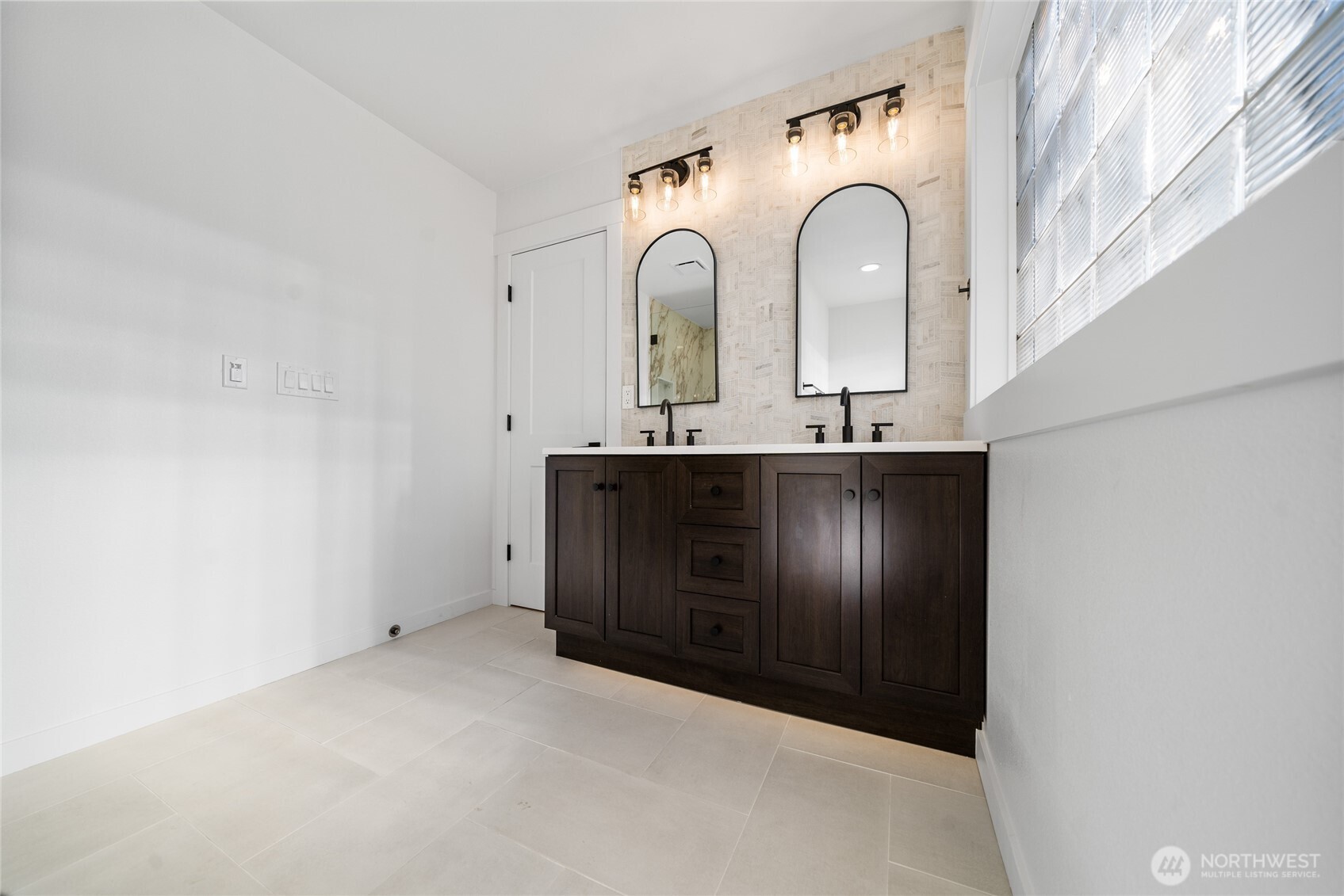 1308 19th Avenue Longview, WA 98632 - Photo 17 of 24 a bathroom with a sink and a mirror