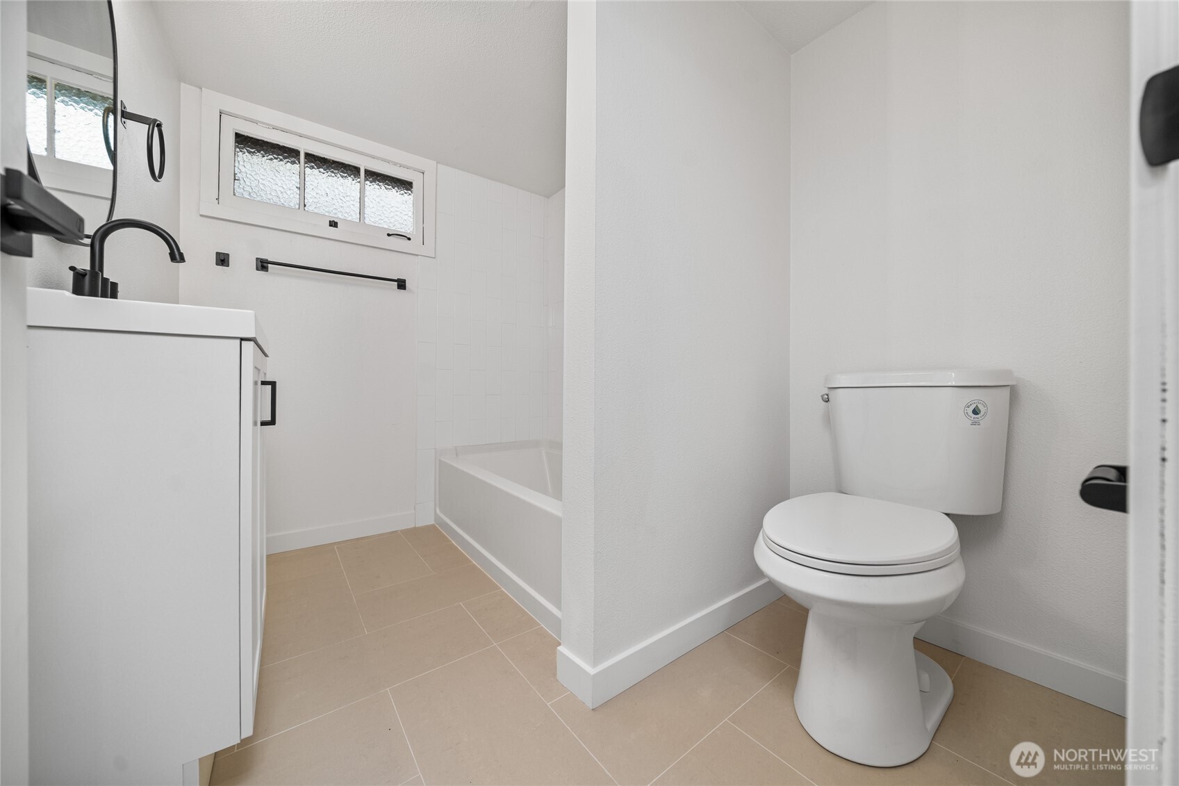 1308 19th Avenue Longview, WA 98632 - Photo 22 of 24 a bathroom with a sink toilet and a mirror