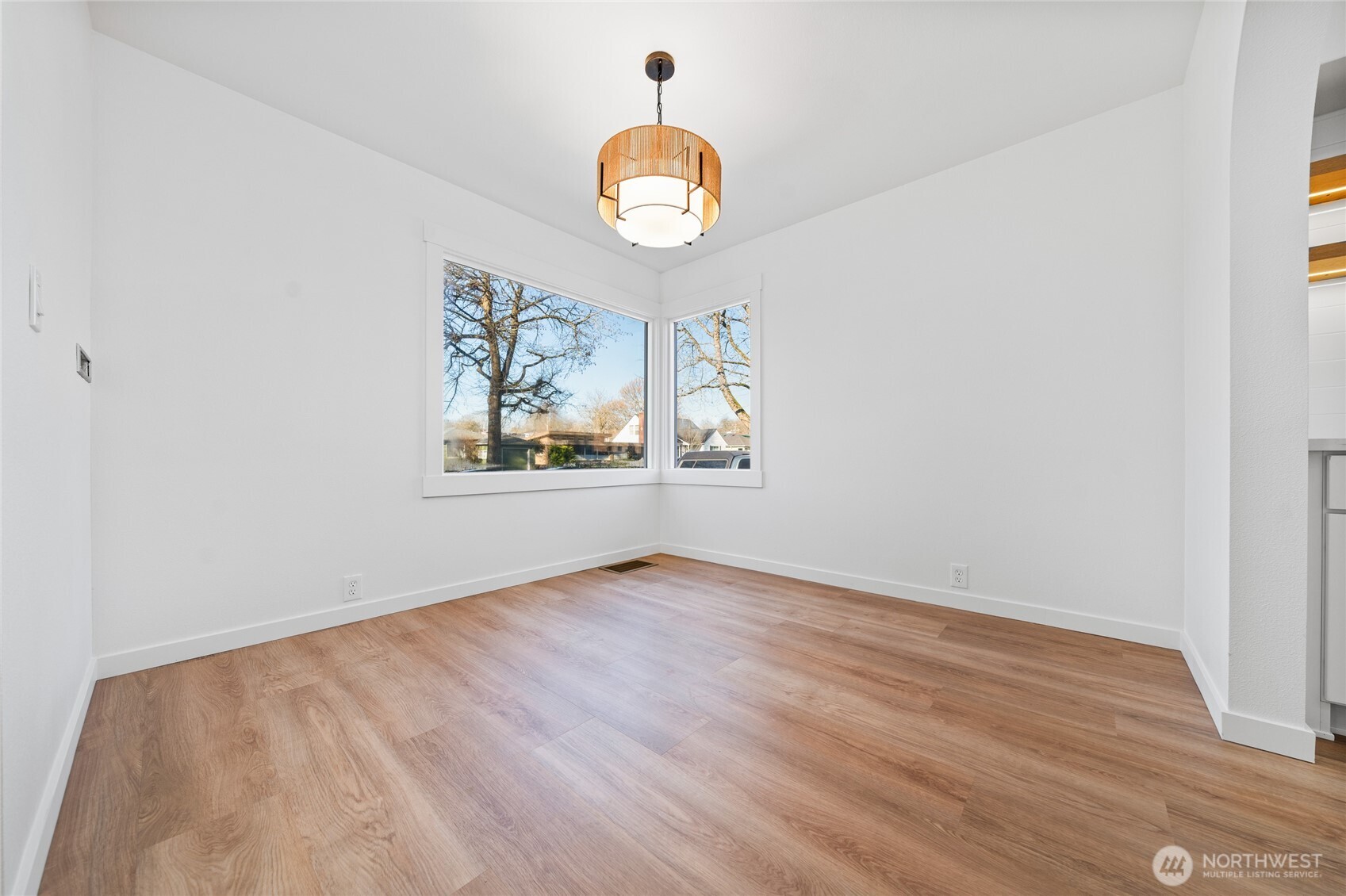 1308 19th Avenue Longview, WA 98632 - Photo 6 of 24 an empty room with wooden floor and a window