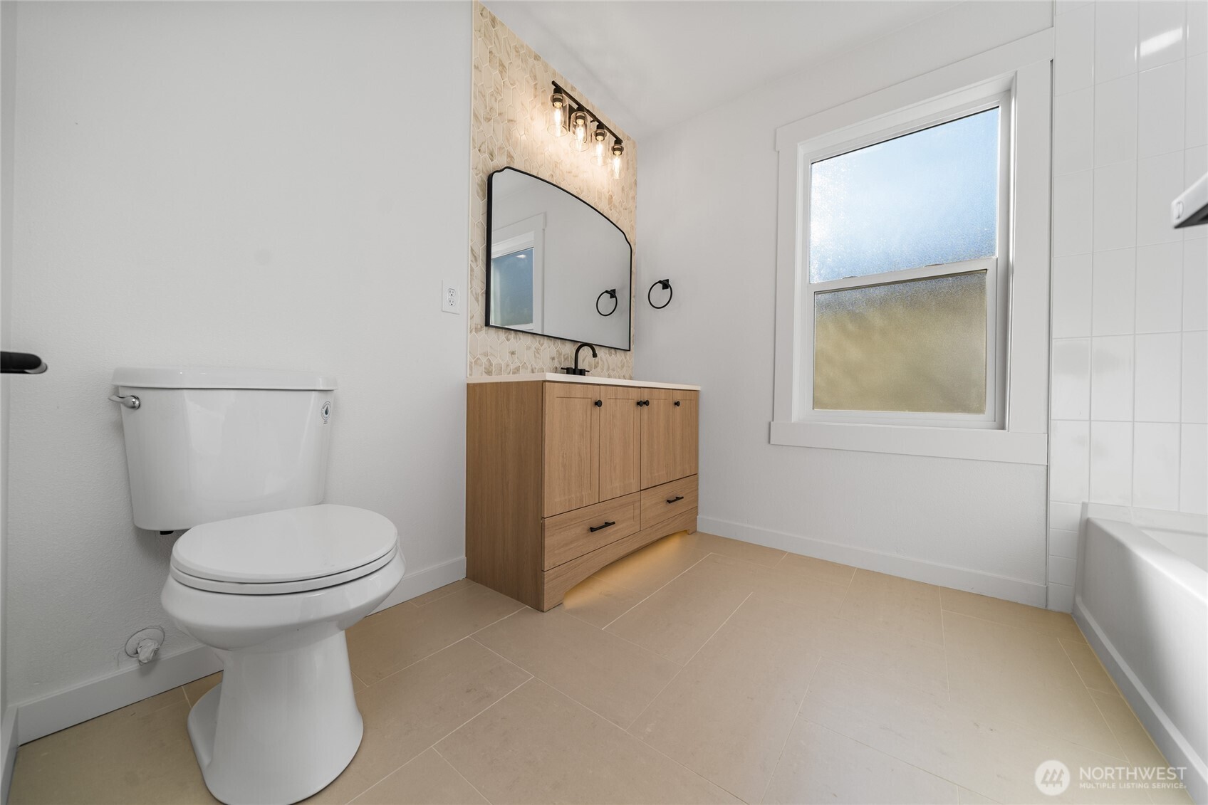 1308 19th Avenue Longview, WA 98632 - Photo 7 of 24 a bathroom with a toilet sink and mirror