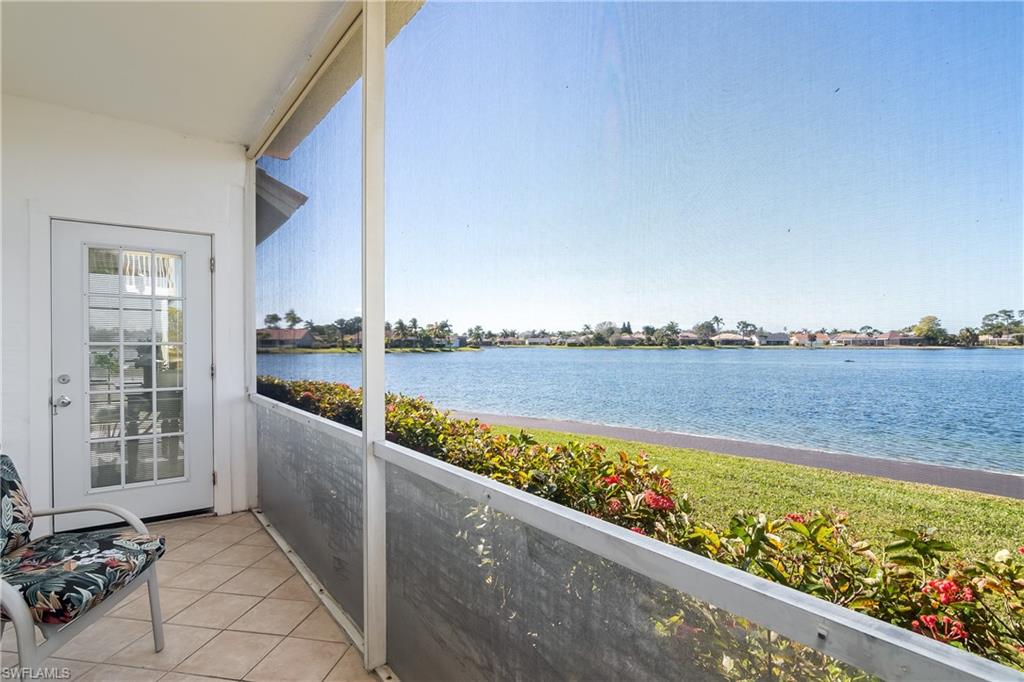 613 Windsor Square, Unit 101 Naples, FL 34104 - Photo 4 of 23 a view of a balcony with an ocean view