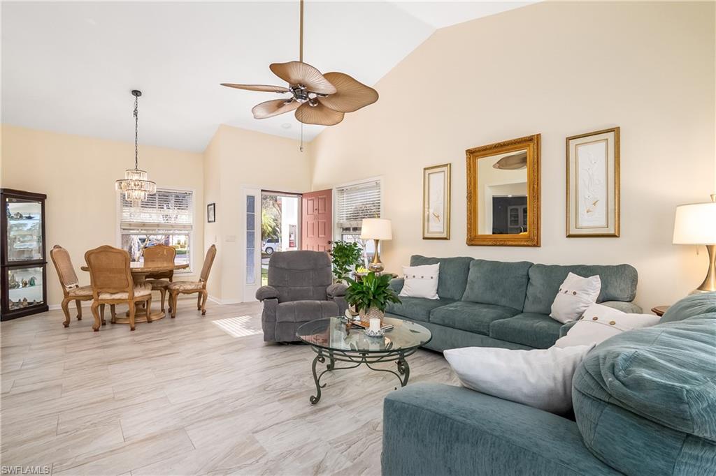 613 Windsor Square, Unit 101 Naples, FL 34104 - Photo 9 of 23 a living room with furniture