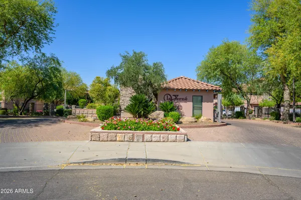 a front view of a house with a yard and a garage