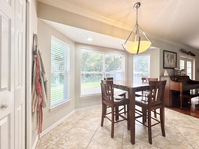 4258 Shadow Lane Niceville, FL 32578 - Photo 12 of 35 a view of a dining room with furniture window and chandelier