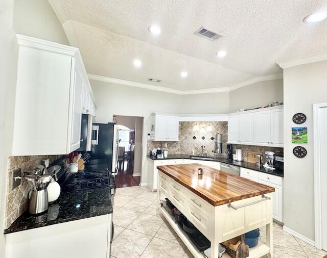 4258 Shadow Lane Niceville, FL 32578 - Photo 14 of 35 a kitchen with stainless steel appliances granite countertop a sink stove and refrigerator