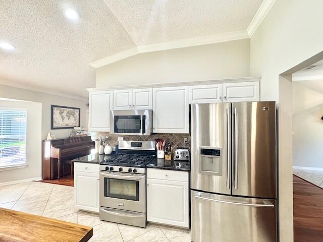 4258 Shadow Lane Niceville, FL 32578 - Photo 16 of 35 a kitchen with stainless steel appliances a refrigerator stove and microwave