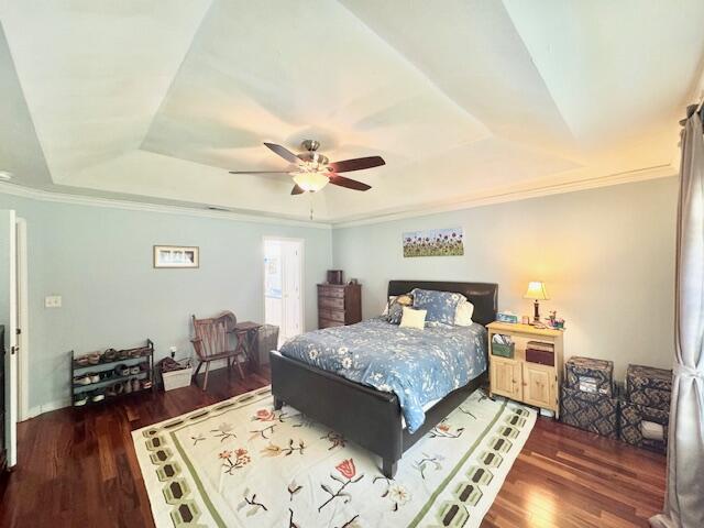 4258 Shadow Lane Niceville, FL 32578 - Photo 19 of 35 a bedroom with a bed and wooden floor