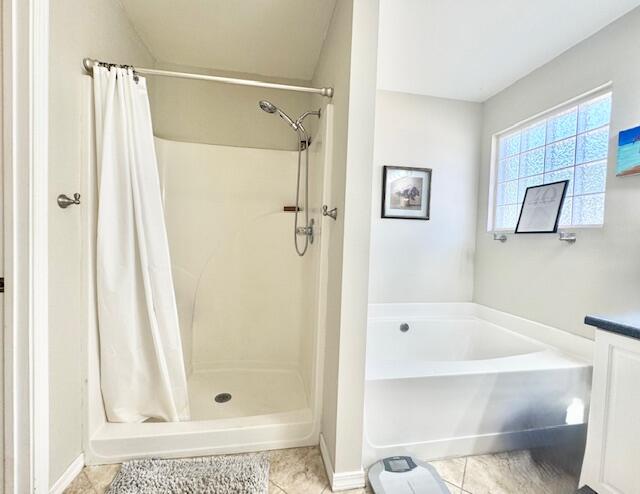4258 Shadow Lane Niceville, FL 32578 - Photo 22 of 35 a bathroom with a bathtub and a shower
