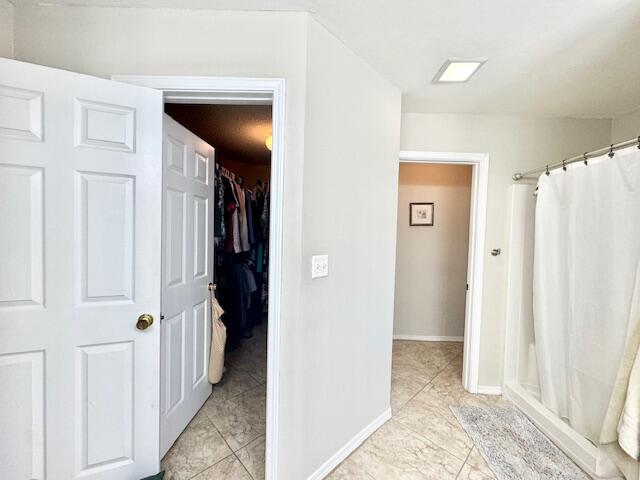 4258 Shadow Lane Niceville, FL 32578 - Photo 25 of 35 a view of a hallway with closet and bathroom