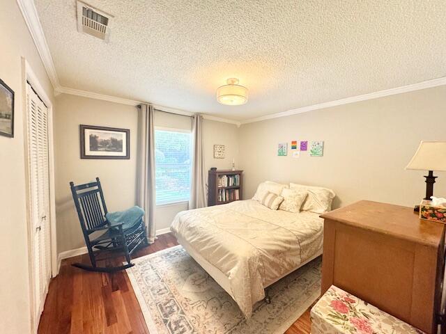 4258 Shadow Lane Niceville, FL 32578 - Photo 26 of 35 a bedroom with a bed and wooden floor