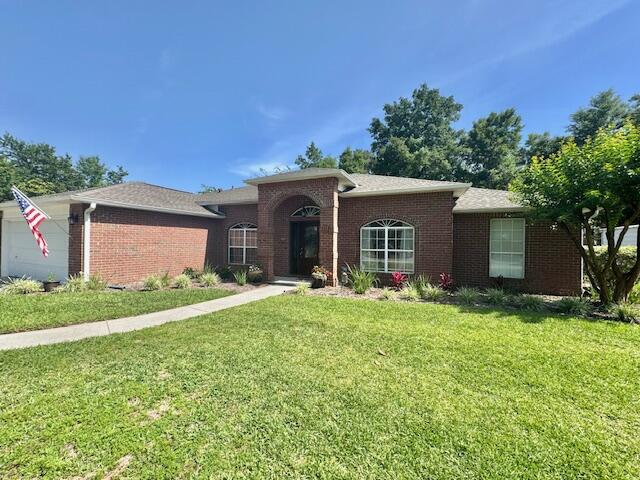 4258 Shadow Lane Niceville, FL 32578 - Photo 3 of 35 a front view of house with yard and trees