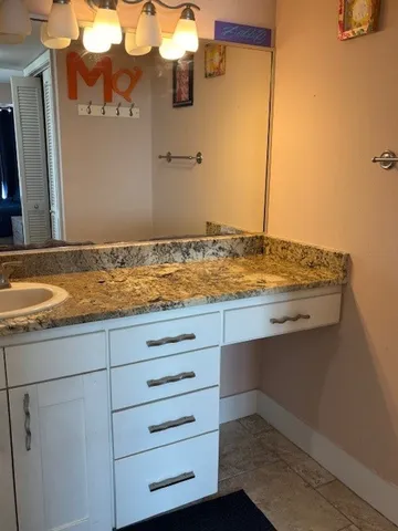 a view of a ocean beach and city