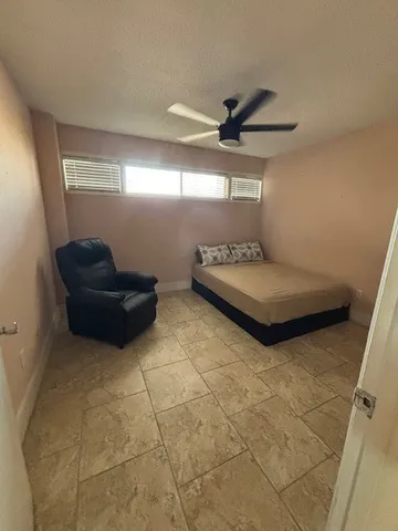 a view of an empty room and staircase