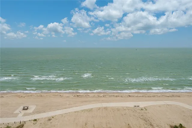 a large kitchen with stainless steel appliances granite countertop a stove a sink and a refrigerator