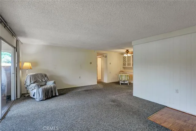 a view of a room with a window and a lamp