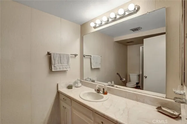 a bathroom with a shower and a toilet