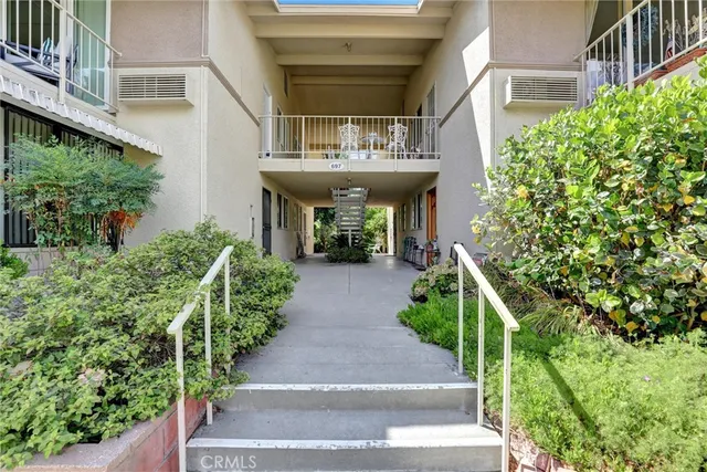 a view of backyard with swimming pool and outdoor seating