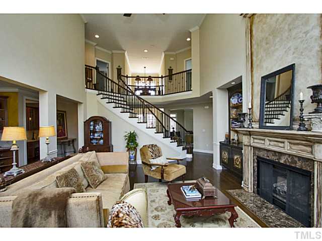 10001 Hidden Vale Drive Raleigh, NC 27614 - Photo 11 of 24 a living room with furniture a fireplace and a flat screen tv