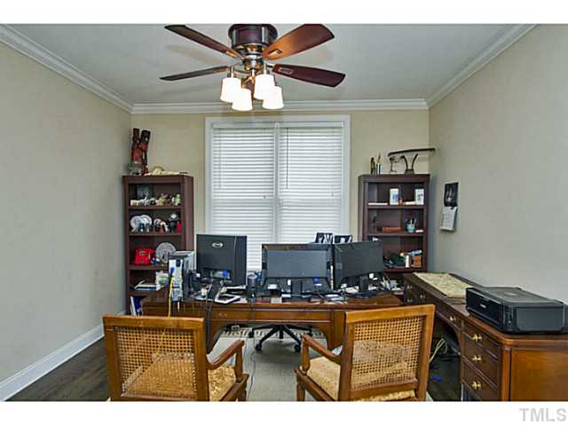 10001 Hidden Vale Drive Raleigh, NC 27614 - Photo 16 of 24 a room with furniture a chandelier and a projector