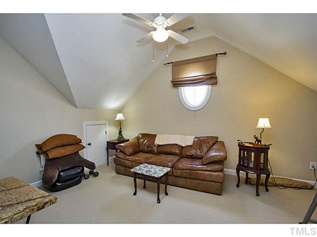 10001 Hidden Vale Drive Raleigh, NC 27614 - Photo 19 of 24 a living room with furniture and a chandelier