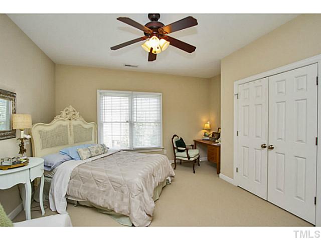 10001 Hidden Vale Drive Raleigh, NC 27614 - Photo 21 of 24 a bed room with a bed and a ceiling fan