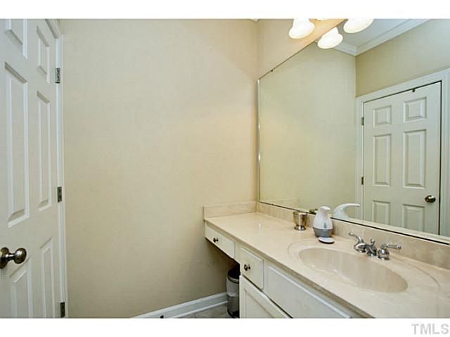10001 Hidden Vale Drive Raleigh, NC 27614 - Photo 24 of 24 a bathroom with a sink and a mirror