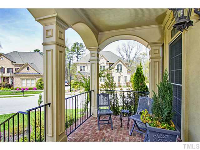 10001 Hidden Vale Drive Raleigh, NC 27614 - Photo 5 of 24 a view of a porch with chairs and potted plants