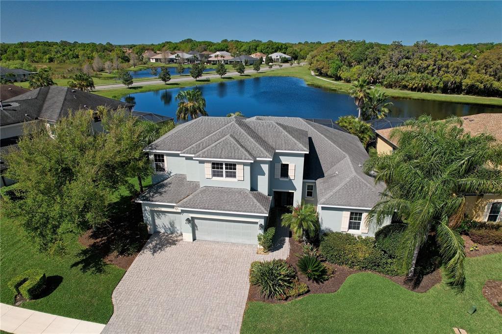 820 Honeyflower Loop Bradenton, FL 34212 - Photo 1 of 1 Exterior Front: lovely lake living. Notice the large three car garage.