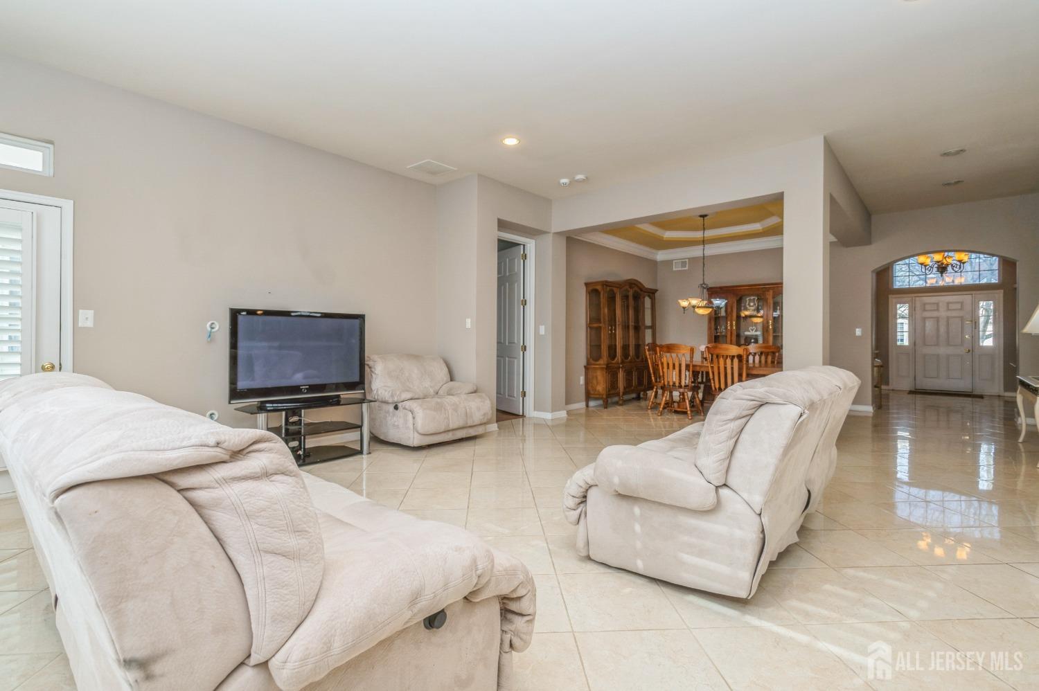 82 Beth Page Drive Monroe Township, NJ 08831 - Photo 14 of 40 a bedroom with furniture and a couch