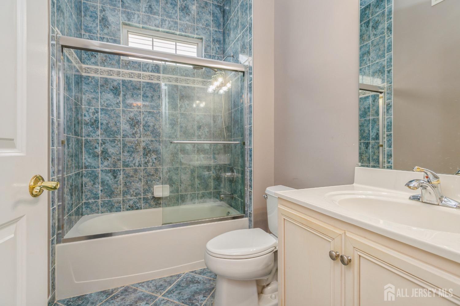 82 Beth Page Drive Monroe Township, NJ 08831 - Photo 20 of 40 a bathroom with a sink toilet and shower