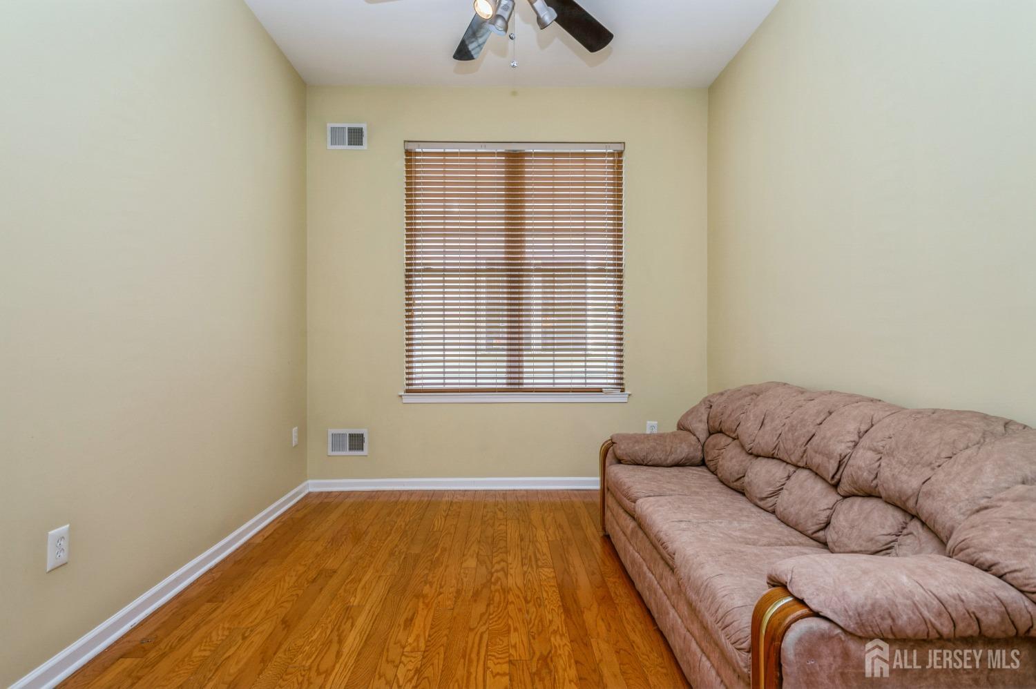 82 Beth Page Drive Monroe Township, NJ 08831 - Photo 21 of 40 a bedroom with a bed and a couch