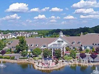 82 Beth Page Drive Monroe Township, NJ 08831 - Photo 28 of 40 a aerial view of a house with a garden and lake view