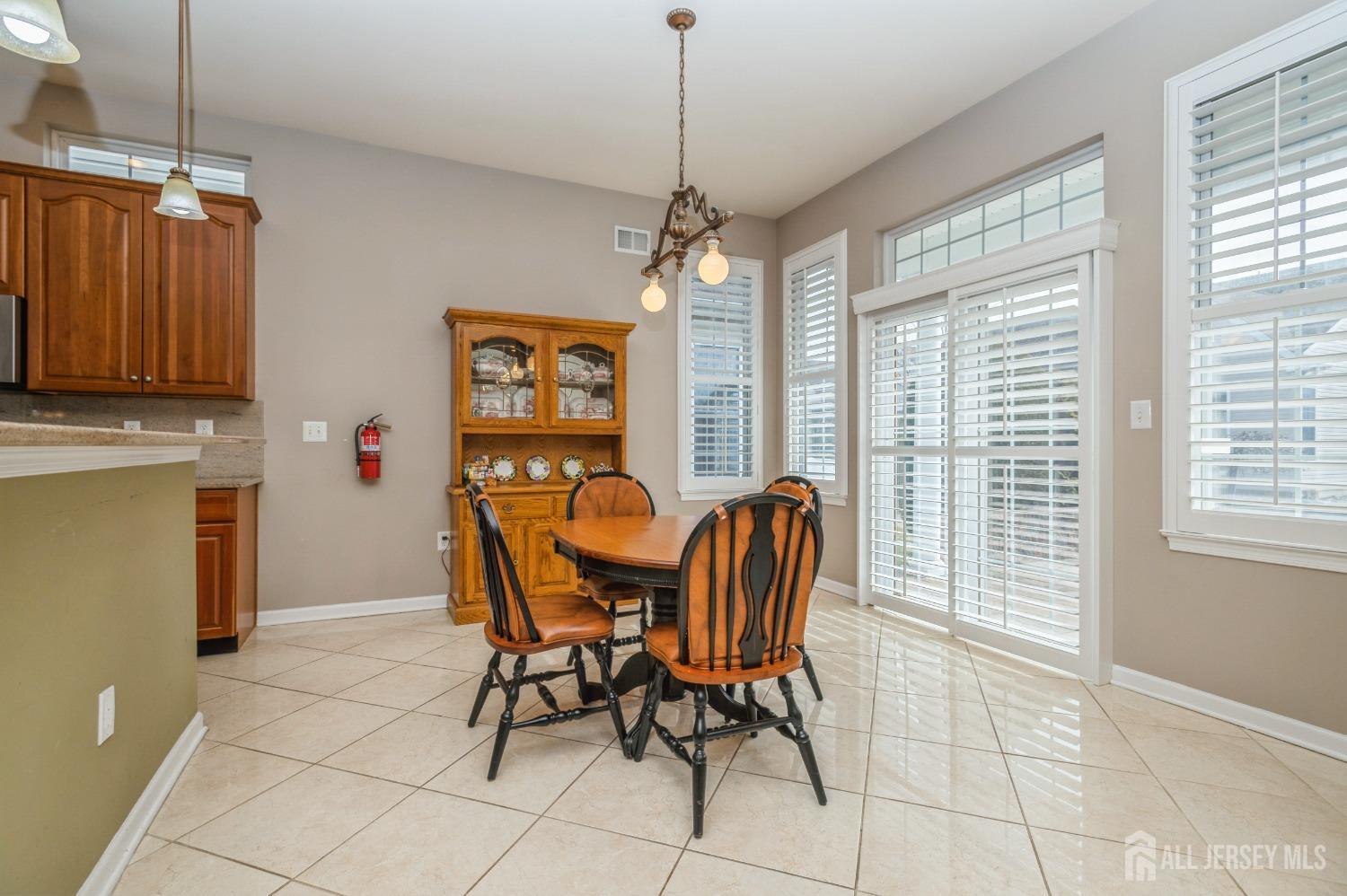 82 Beth Page Drive Monroe Township, NJ 08831 - Photo 5 of 40 a dining room with furniture and window
