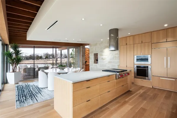 a kitchen with a stove and a white refrigerator