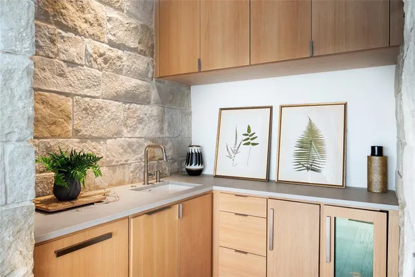 a kitchen with stainless steel appliances granite countertop a sink and a white cabinets