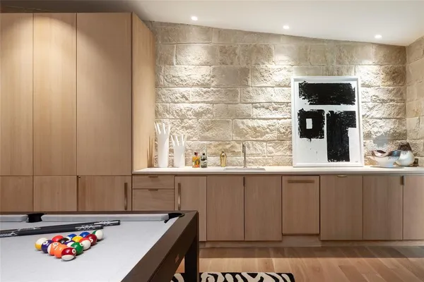 a bathroom with a sink and a large mirror