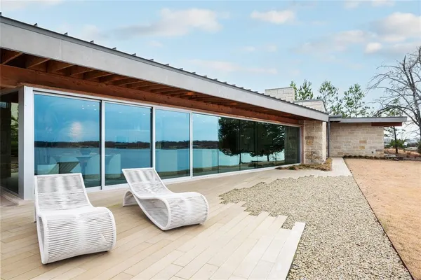 a balcony with furniture and a potted plant