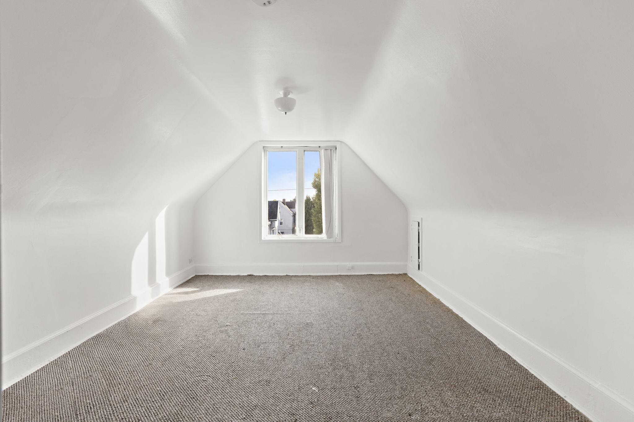 43 West 43rd Street Bayonne, NJ 07002 - Photo 16 of 22 an empty room with windows