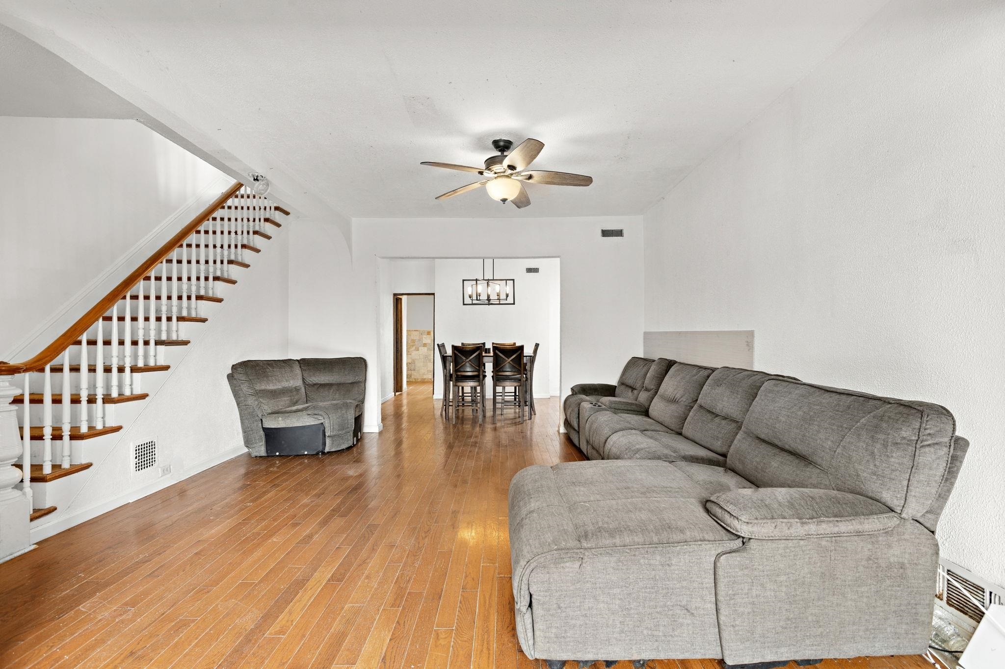 43 West 43rd Street Bayonne, NJ 07002 - Photo 3 of 22 a living room with furniture and wooden floor