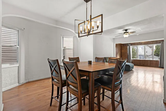 a view of a dining room with furniture window and wooden floor