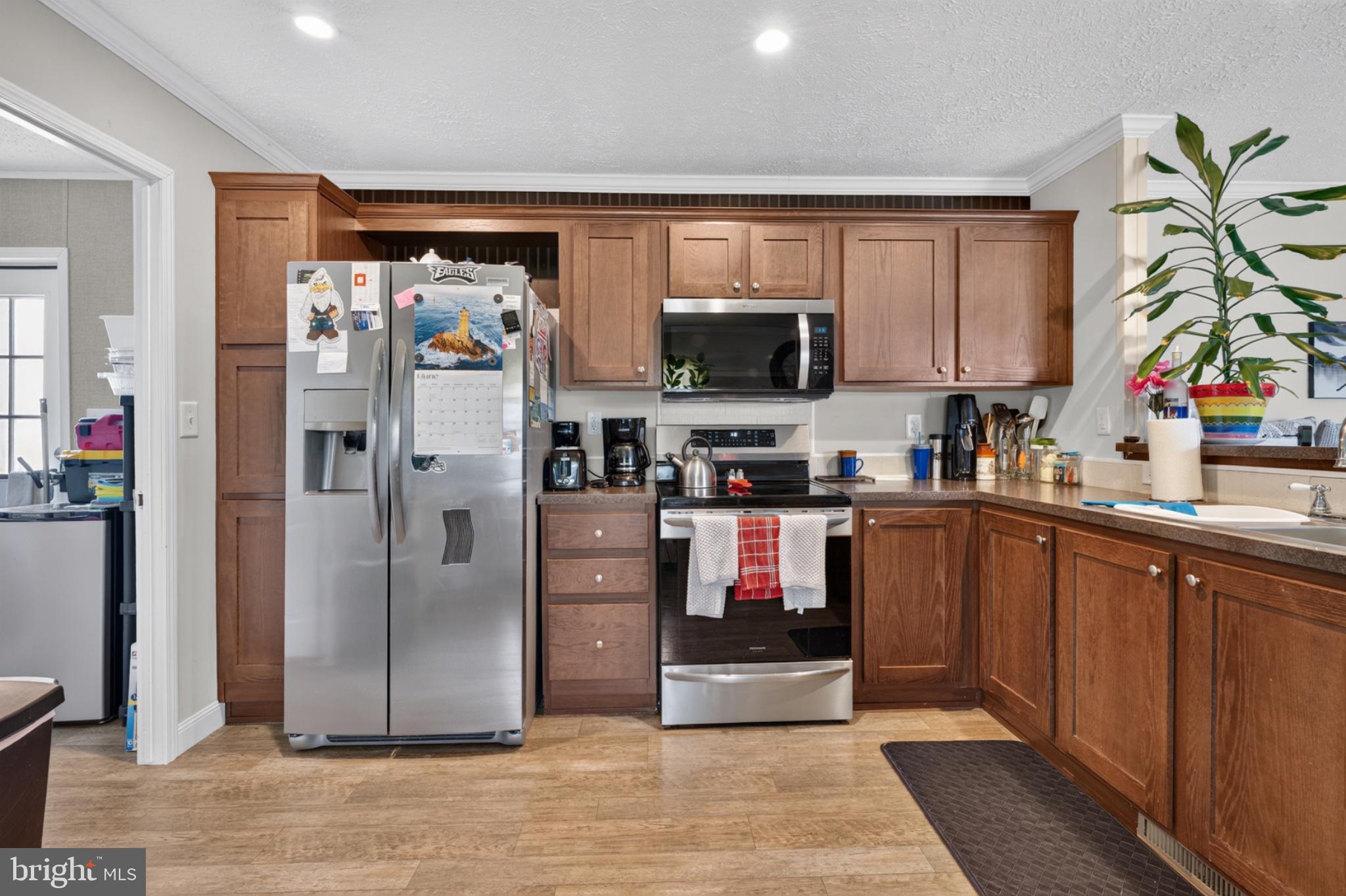 412 Ranee Loop Bear, DE 19701 - Photo 10 of 24 Modern kitchen with warm wood tones.
