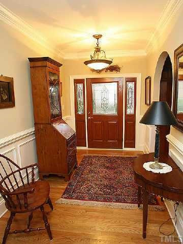 1815 Middlebrook Drive Raleigh, NC 27615 - Photo 6 of 12 Entry foyer with wainscoting and arched opening to the dining room Other