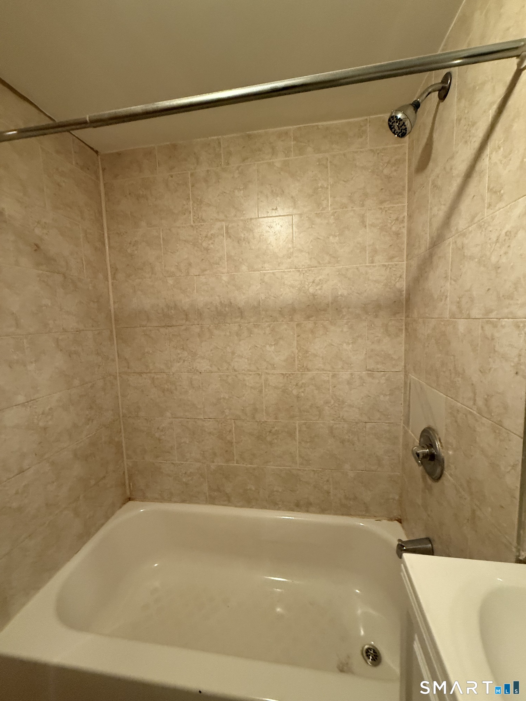 21 North Walnut Street, Unit 3 Waterbury, CT 06704 - Photo 5 of 8 a bathroom with a shower and a bath tub