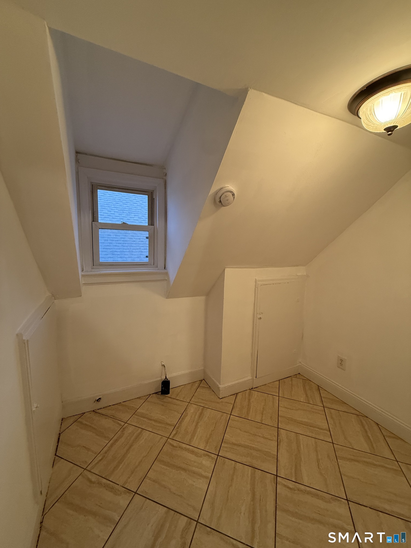 21 North Walnut Street, Unit 3 Waterbury, CT 06704 - Photo 6 of 8 a view of an empty room
